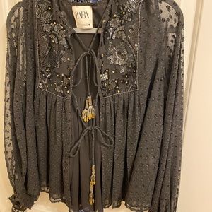 Embellished black long sleeve top